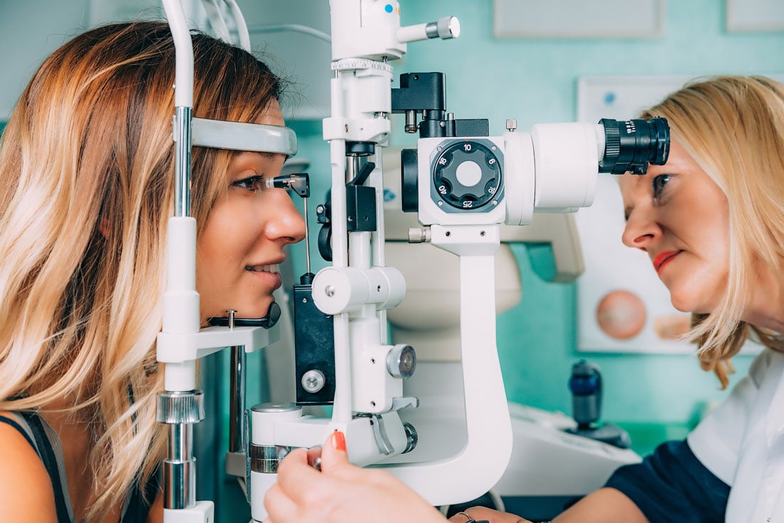 ocular hypertension — patient undergoing applanation tonometry during a comprehensive eye exam to measure eye pressure