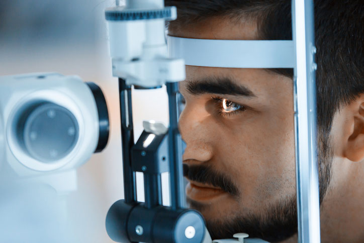 Patient undergoing a LASIK eye surgery consultation with advanced diagnostic eye imaging at Vantage Eye Center