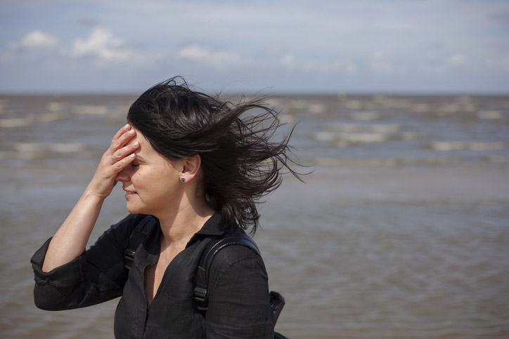 A woman experiencing retinal detachment symptoms.