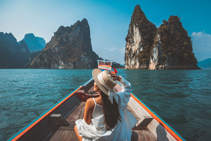 A young woman exploring the sea and the world after having LASIK eye surgery.