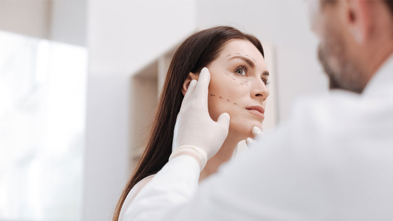 Woman having a pre-consult for dermal filler.